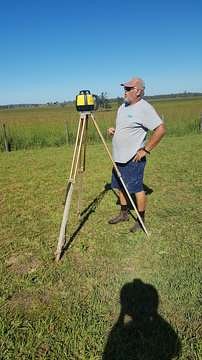 Setting out levels with a laser level in a paddock