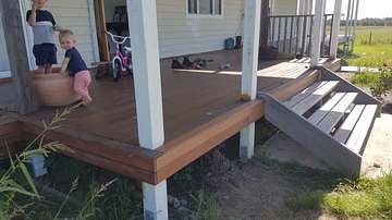 Finished merbau timber deck alongside a weatherboard house
