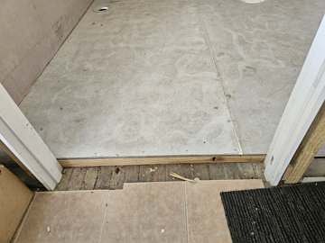 Bathroom stripped back to the bare floor before waterproofing