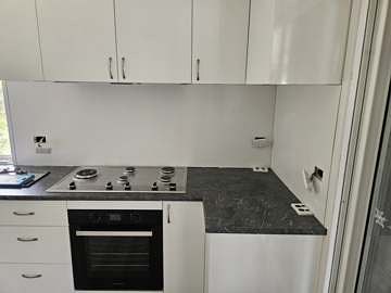 Renovated kitchen with new benchtop and cabinetry